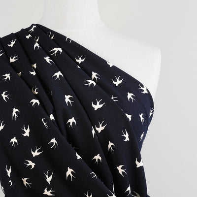 Alton - Navy Swallows Stretch Scuba Crepe Fabric Mannequin Close Up Image from Patternsandplains.com