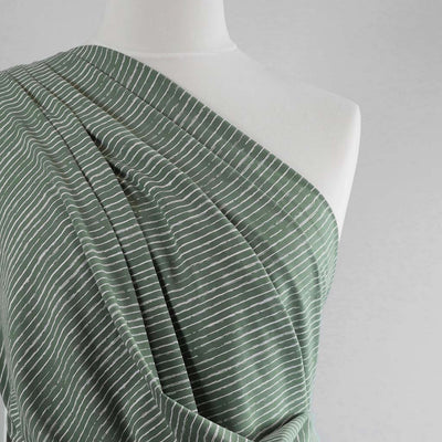 Arizona - Pistachio Green Sketch Stripe, Single Jersey Cotton Elastane Print Fabric Mannequin Close Up Image from Patternsandplains.com