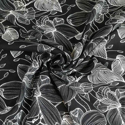 Capri - Black Etched Leaves Viscose Woven Fabric Detail Swirl Image from Patternsandplains.com