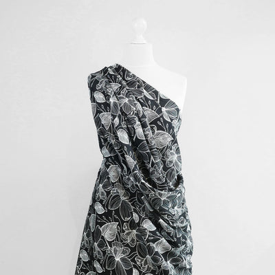 Capri - Black Etched Leaves Viscose Woven Fabric Mannequin Wide Image from Patternsandplains.com