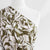 Capri - Dark Moss Green Foliage Viscose Woven Fabric Mannequin Close Up Image from Patternsandplains.com