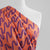 Fine Poplin - Coral Making Waves Cotton Woven Fabric by Nerida Hansen Mannequin Close Up Image from Patternsandplains.com