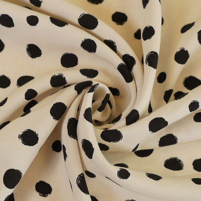 Linz - Parchment Cream Spotty Viscose Woven Twill Fabric Detail Swirl Image from Patternsandplains.com
