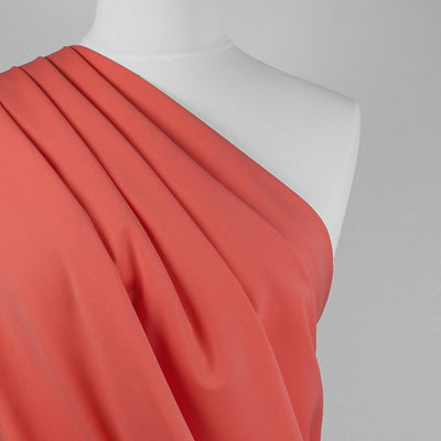 Milan - Light Coral Viscose Rich Ponte de Roma Fabric Mannequin Close Up Image from Patternsandplains.com