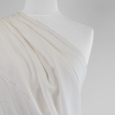 Mons - Natural White Viscose Linen Woven Fabric Mannequin Close Up Image from Patternsandplains.com