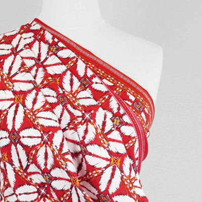 Nassau - Red Geometric Border Viscose Slub Woven Fabric Mannequin Close Up Image from Patternsandplains.com