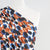 Portia - Blue and Orange Grapes Stretch Jersey Fabric from John Kaldor Mannequin Close Up Image from Patternsandplains.com