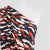 Portia - Navy and Orange Fracture Stretch Jersey Fabric from John Kaldor Mannequin Close Up Image from Patternsandplains.com