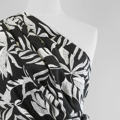 Sierra - Black Leaves Viscose Poplin Woven Fabric Mannequin Close Up Image from Patternsandplains.com