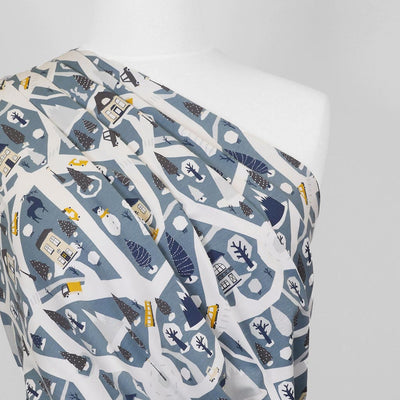 Arizona - Dusty Blue Winter Village, Single Jersey Cotton Elastane Print Fabric Mannequin Close Up Image from Patternsandplains.com