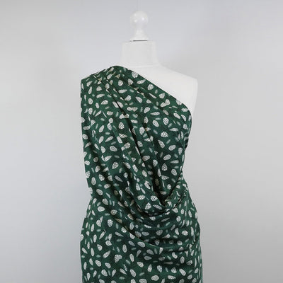 Arizona - Bottle Green Pine Cones, Single Jersey Cotton Elastane Print Fabric Mannequin Wide Image from Patternsandplains.com