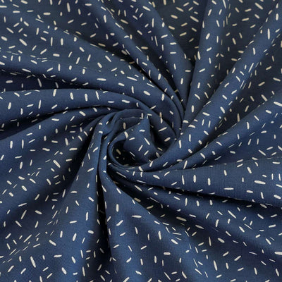 Arizona - Denim Blue Ticker Tape, Single Jersey Cotton Elastane Print Fabric Detail Swirl Image from Patternsandplains.com