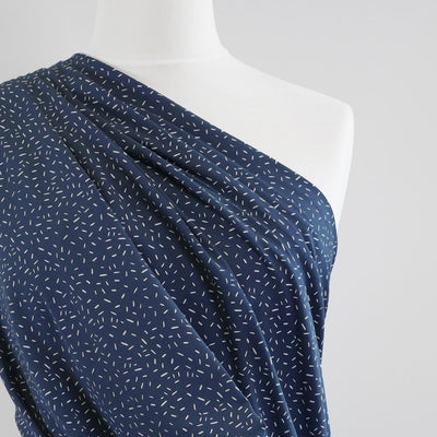 Arizona - Denim Blue Ticker Tape, Single Jersey Cotton Elastane Print Fabric Mannequin Close Up Image from Patternsandplains.com