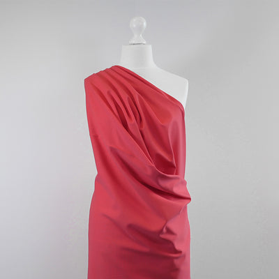 Milan - Coral Pink Viscose Rich Ponte de Roma Fabric Mannequin Wide Image from Patternsandplains.com