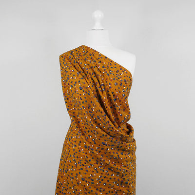 Monroe - Maize Yellow Seedlings Woven Crepe Fabric Mannequin Wide Image from Patternsandplains.com