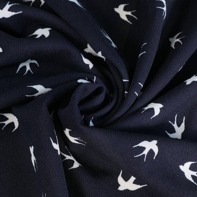 Alton - Navy Swallows Stretch Scuba Crepe Fabric Detail Swirl Image from Patternsandplains.com