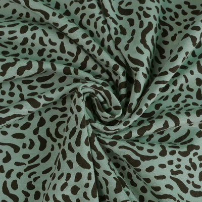 Arizona - Light Turquoise Dots, Single Jersey Organic Cotton Elastane Fabric Detail Swirl Image from Patternsandplains.com