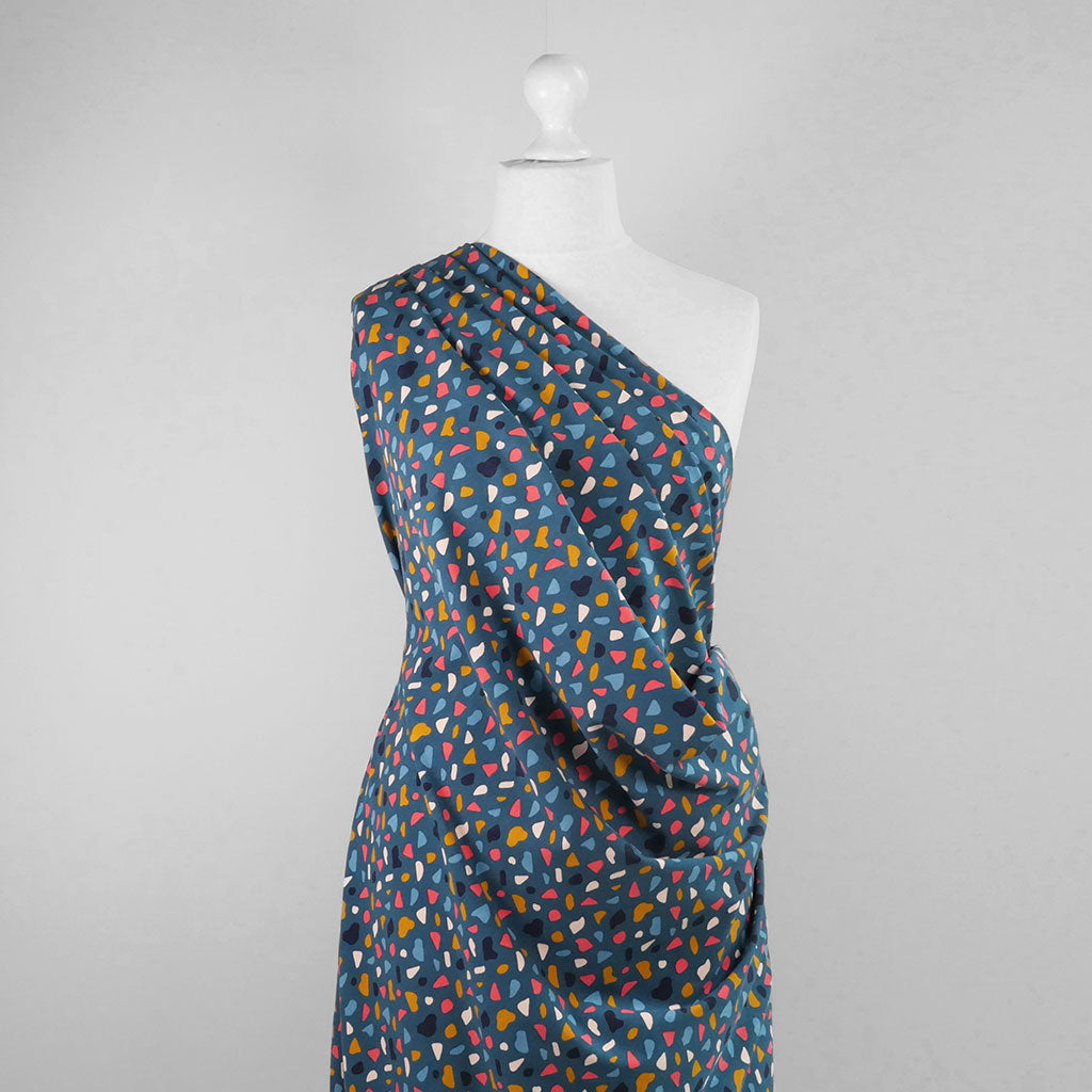 Arizona - Petrol Shapes, Single Jersey Organic Cotton Elastane Fabric Mannequin Wide Image from Patternsandplains.com