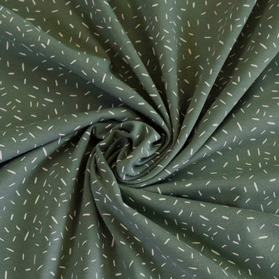Arizona - Pistachio Green Ticker Tape, Single Jersey Cotton Elastane Print Fabric Detail Swirl Image from Patternsandplains.com
