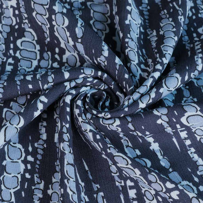 Avignon - Blue Bubbles Viscose Crinkle Woven Fabric Detail Swirl Image from Patternsandplains.com