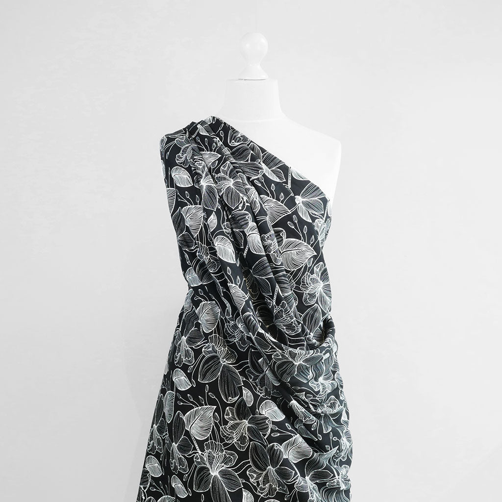 Capri - Black Etched Leaves Viscose Woven Fabric Mannequin Wide Image from Patternsandplains.com