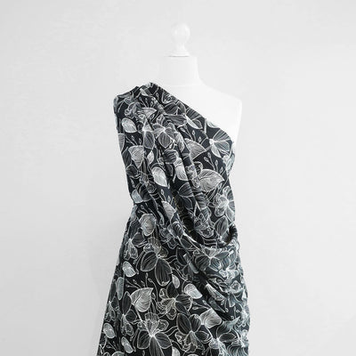 Capri - Black Etched Leaves Viscose Woven Fabric Mannequin Wide Image from Patternsandplains.com