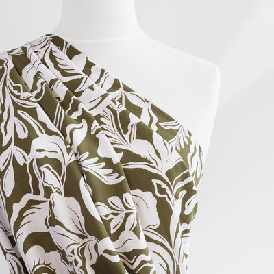 Capri - Dark Moss Green Foliage Viscose Woven Fabric Mannequin Close Up Image from Patternsandplains.com