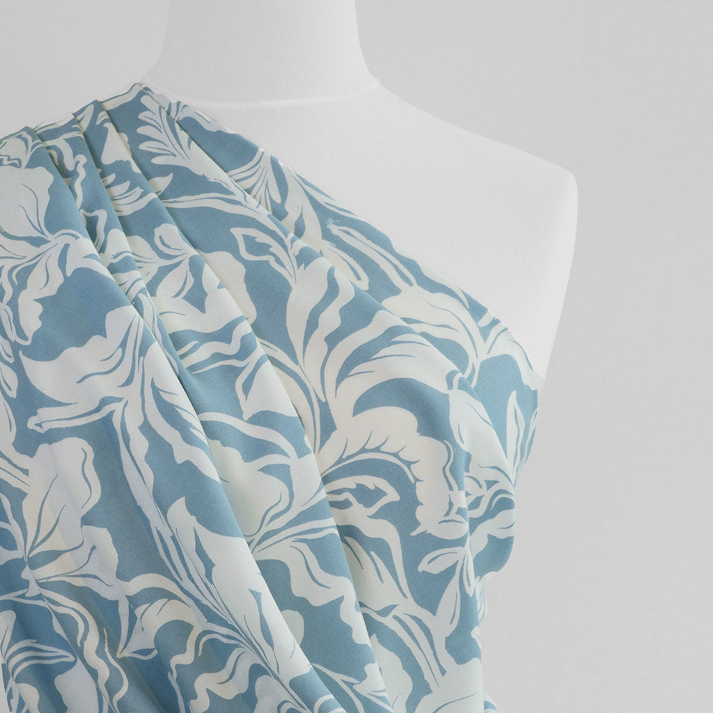 Capri - Stone Blue Foliage Viscose Woven Fabric Mannequin Close Up Image from Patternsandplains.com