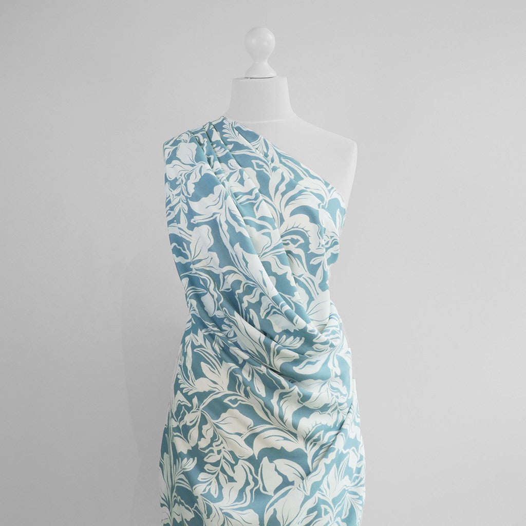 Capri - Stone Blue Foliage Viscose Woven Fabric Mannequin Wide Image from Patternsandplains.com
