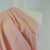 Clare Starfish Pink 100% Pure Linen Woven Fabric Mannequin Closeup Image from Patternsandplains.com