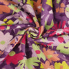 Dark Purple Pop Blossom, Single Jersey Organic Cotton Elastane Fabric by Nerida Hansen Detail Swirl Image from Patternsandplains.com