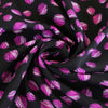 Leck - Magenta on Black, Almost Spots Viscose Woven Twill Fabric Detail Swirl Image from Patternsandplains.com