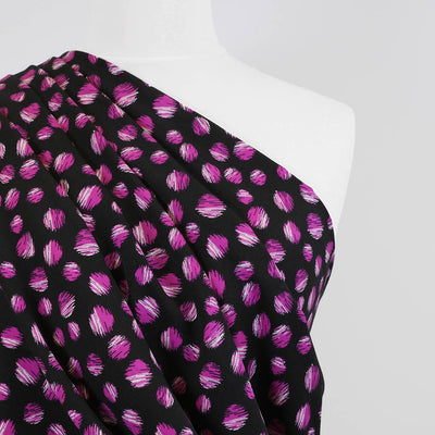 Leck - Magenta on Black, Almost Spots Viscose Woven Twill Fabric Mannequin Close Up Image from Patternsandplains.com
