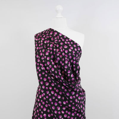 Leck - Magenta on Black, Almost Spots Viscose Woven Twill Fabric Mannequin Wide Image from Patternsandplains.com