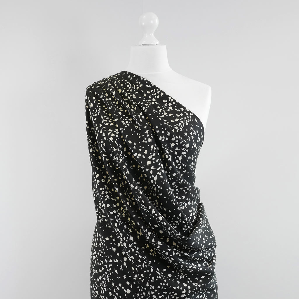 Linz- Black Animal Elements Viscose Woven Twill Fabric Mannequin Wide Image from Patternsandplains.com