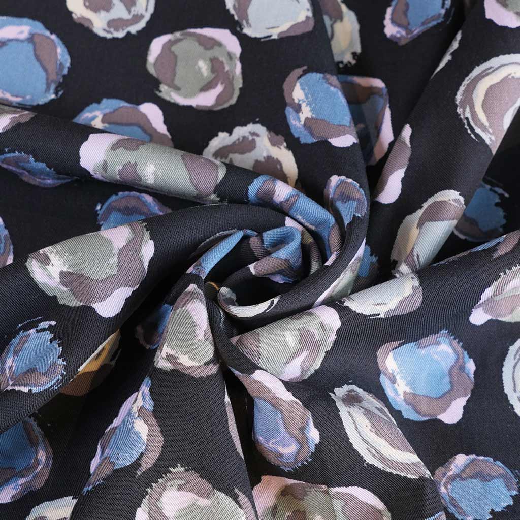 Linz - Blue Planets Viscose Woven Twill Fabric Detail Swirl Image from Patternsandplains.com