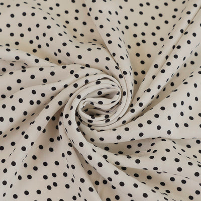 Linz - Parchment Cream Dotty Viscose Woven Twill Fabric Detail Swirl Image from Patternsandplains.com
