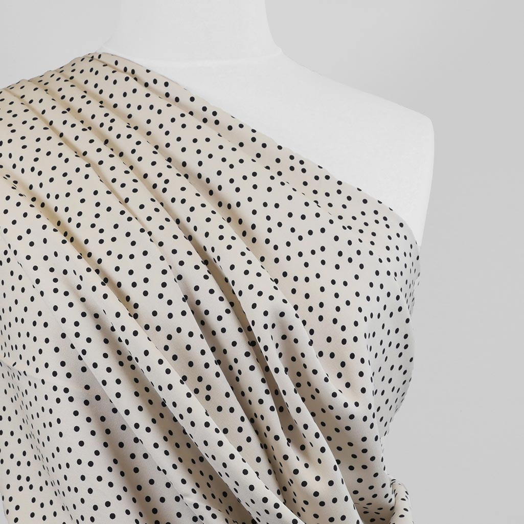 Linz - Parchment Cream Dotty Viscose Woven Twill Fabric Mannequin Close Up Image from Patternsandplains.com