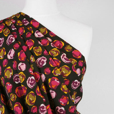 Linz - Pink Planets Viscose Woven Twill Fabric Mannequin Close Up Image from Patternsandplains.com