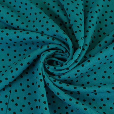 Linz - Turquoise Dotty Viscose Woven Twill Fabric Detail Swirl Image from Patternsandplains.com