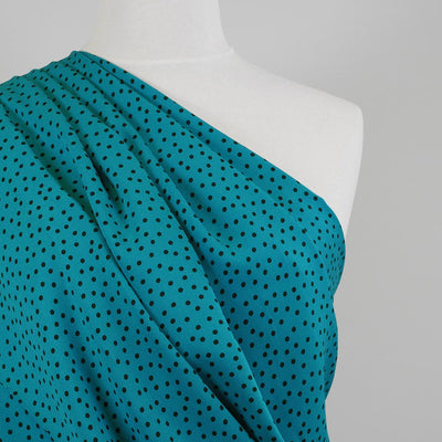 Linz - Turquoise Dotty Viscose Woven Twill Fabric Mannequin Close Up Image from Patternsandplains.com