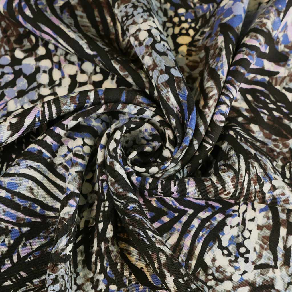 Linz - Lilac Wild Forest Viscose Woven Twill Fabric Detail Swirl Image from Patternsandplains.com