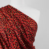 Loire - Red Double Spots Viscose Crepe Fabric Mannequin Close Up Image from Patternsandplains.com
