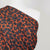 Madrid 4616 - Orange and Navy Scribbled Squares Woven Crepe Fabric from John Kaldor Mannequin Close Up Image from Patternsandplains.com