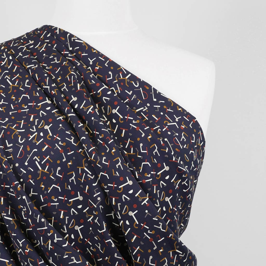 Monroe - Navy Jumbled Woven Crepe Fabric Mannequin Close Up Image from Patternsandplains.com