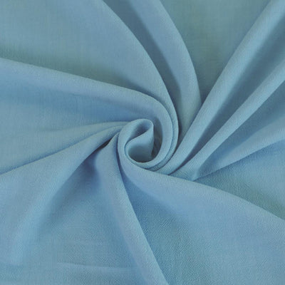Mons - Celestial Blue Viscose Linen Woven Fabric Detail Swirl Image from Patternsandplains.com