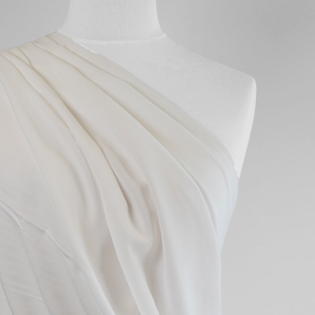 Mons - Natural White Viscose Linen Woven Fabric Mannequin Close Up Image from Patternsandplains.com