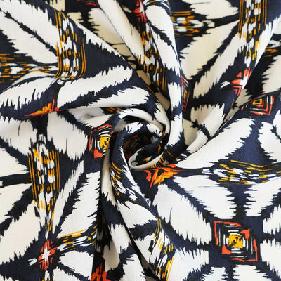 Nassau - Blue Geometric Border Viscose Slub Woven Fabric Detail Swirl Image from Patternsandplains.com