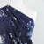 Niva - Blues Flowers and Dots Bubble Crepe Woven Fabric Mannequin Close Up Image from Patternsandplains.com