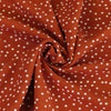 Palermo - Ginger Orange Dots Viscose Linen Woven Fabric Detail Swirl Image from Patternsandplains.com